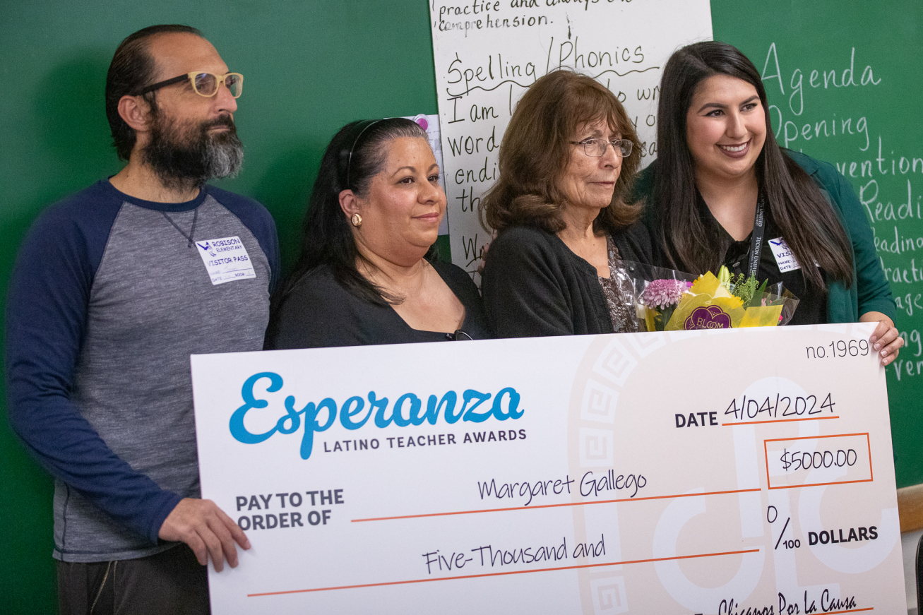 Ms. Gallego and staff from Chicanos Por La Causa pose with her $5,000 check awarded by CPLC
