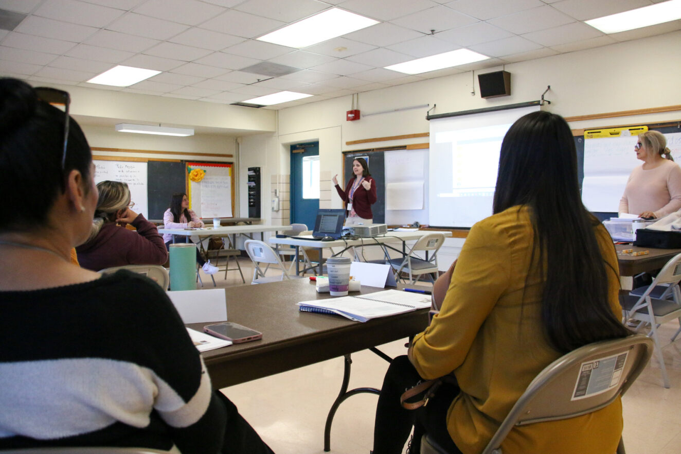 A group of parents participate in a class at the Menlo FRC.